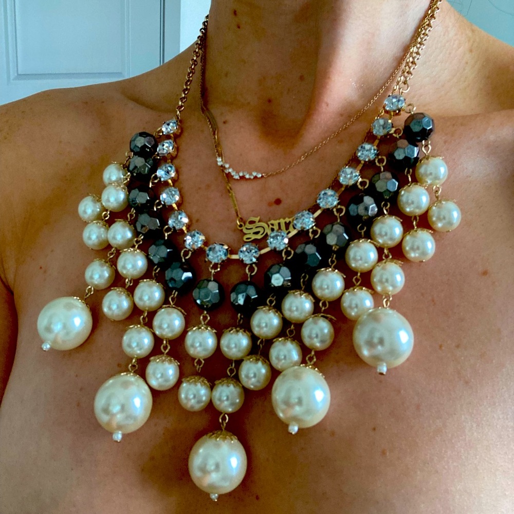 Feel like royalty in this pearl and jewel statement necklace!
